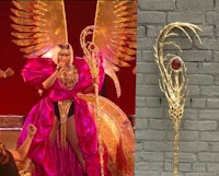 a woman in a pink dress is holding a golden wand