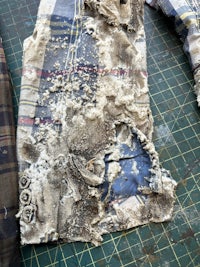 a piece of clothing that has been torn apart