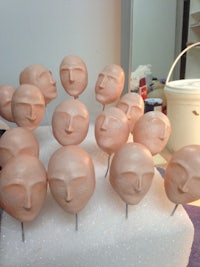 a bunch of heads on top of a table